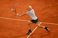 Denis Shapovalov plays a backhand at French Open